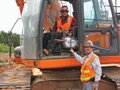 DeVere Construction Company Assistant Project Manager Randy Perry (right) says Doosan heavy equipment has good visibility for operators like the one in this crawler excavator.